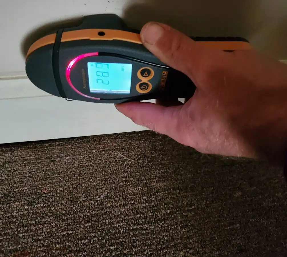 Moisture detection at baseboard during Storm Damage Restoration in Pollock Pines